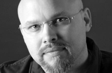 Close-up black and white photograph of writer David Vance