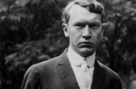 Black and white headshot of "traveling bard"  Vachel Lindsay outdoors.