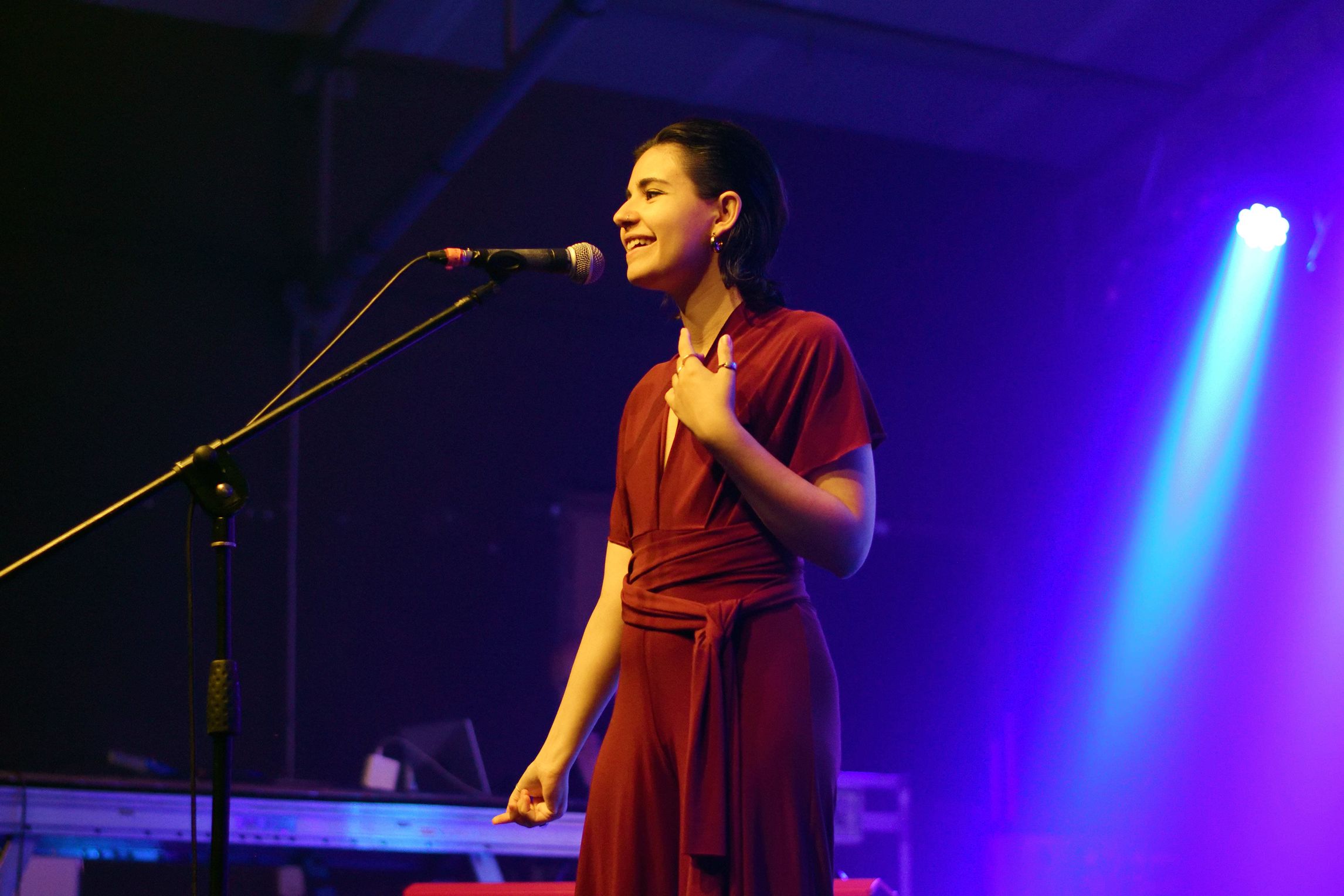 Slam poet performer on stage with a microphone
