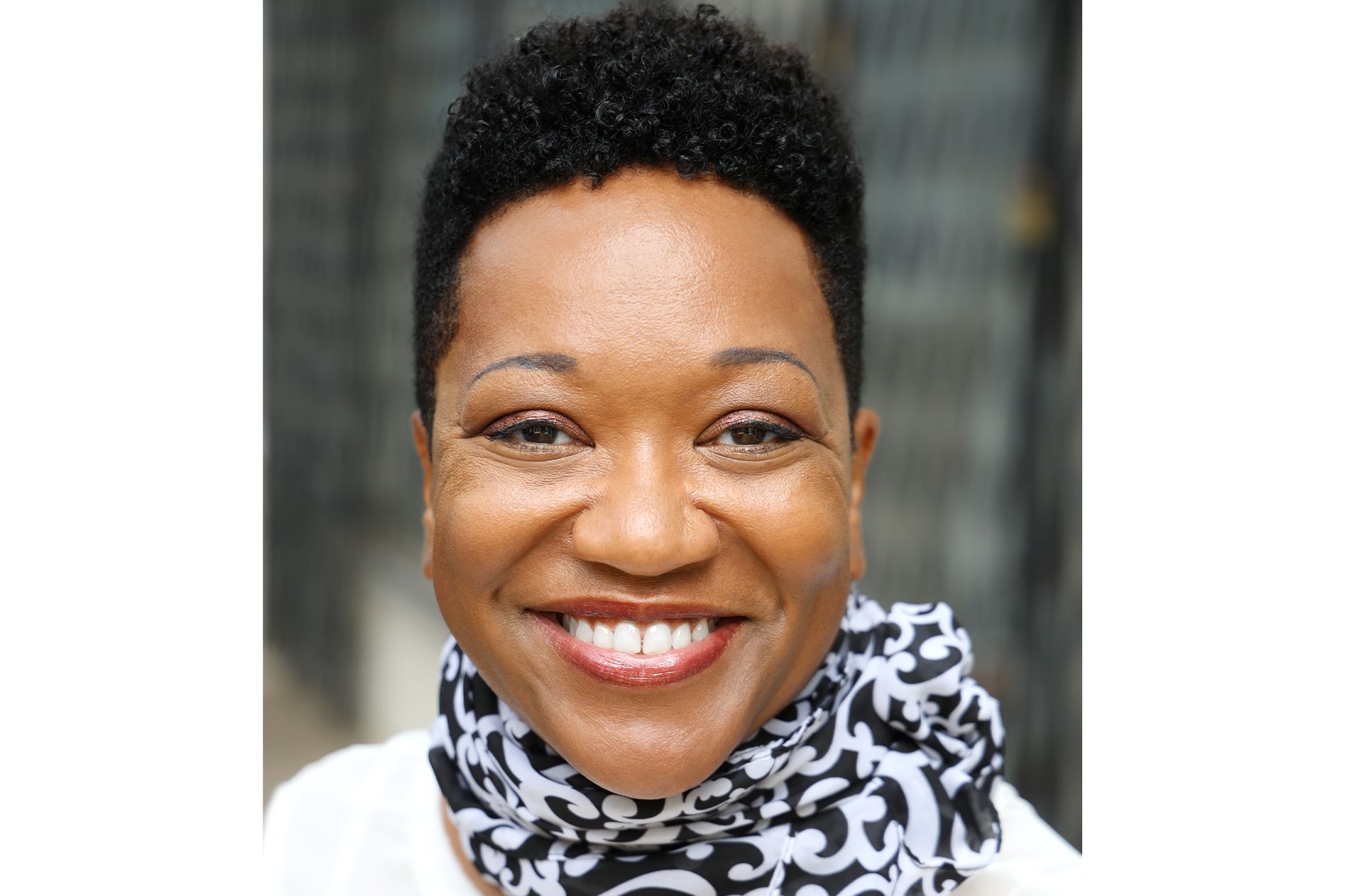 A photograph of Artress Bethany White smiling at the camera.